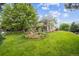 Lush front yard and mature trees enhance the curb appeal of this two-story home at 2240 Summitview Dr, Longmont, CO 80504