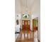Foyer with hardwood flooring, a chandelier, and a front door with sidelights at 2240 Summitview Dr, Longmont, CO 80504