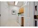Well-lit laundry room features a modern washer and dryer, storage cabinets and white walls at 2240 Summitview Dr, Longmont, CO 80504