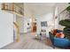 Bright living room boasts high ceilings, large windows, plush carpet, and stylish furnishings at 2240 Summitview Dr, Longmont, CO 80504