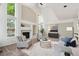 Vaulted living room features many windows, a fireplace, and is brightly lit with natural light at 2240 Summitview Dr, Longmont, CO 80504