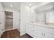 Bathroom featuring double sinks, and a glass enclosed shower with modern finishes at 1416 Orchard St, Brighton, CO 80601