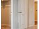 Open closet with clothing rod and a doorway to another room at 1416 Orchard St, Brighton, CO 80601