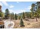 Picturesque backyard with natural landscape and beautiful mountain views at 21798 Wagon Rim Trl, Morrison, CO 80465