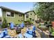 Spacious backyard featuring multiple entertaining zones with cozy firepit area and a flagstone dining patio at 6248 E Mineral Pl, Centennial, CO 80112