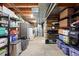 Unfinished basement with a utility area and storage shelves, offering potential for customization at 6248 E Mineral Pl, Centennial, CO 80112