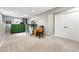 Finished basement area features neutral carpet, painted walls, a desk, and ample space for various activities at 6248 E Mineral Pl, Centennial, CO 80112