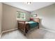 Cozy bedroom features a wooden bed frame and soft carpet at 6248 E Mineral Pl, Centennial, CO 80112