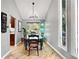 Charming dining room with high ceilings, modern chandelier, and a large window at 6248 E Mineral Pl, Centennial, CO 80112