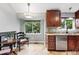 Bright kitchen is equipped with stainless steel appliances, granite countertops, and a breakfast nook at 6248 E Mineral Pl, Centennial, CO 80112