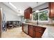 Well-lit kitchen boasts granite countertops, stainless steel appliances, and ample cabinet space at 6248 E Mineral Pl, Centennial, CO 80112