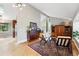 Bright living room with hardwood floors and a seamless flow to the open floor plan at 6248 E Mineral Pl, Centennial, CO 80112