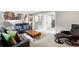 Bright living room with carpeted floors, stairs, and comfortable seating; perfect for relaxing and entertaining at 6248 E Mineral Pl, Centennial, CO 80112