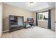 Inviting office space with modern cabinet, desk, chair, and natural light from the window at 6248 E Mineral Pl, Centennial, CO 80112