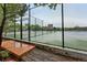 Outdoor tennis court surrounded by fencing and trees for recreational enjoyment at 6248 E Mineral Pl, Centennial, CO 80112