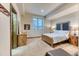 Bedroom with soft natural light, wood furnishings, and neutral colored walls at 16713 W Archer Ave, Golden, CO 80401