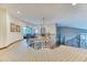 Upstairs hallway with decorative railings and views to a living area with high windows at 16713 W Archer Ave, Golden, CO 80401