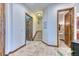 Inviting hallway with stone floors, wood trim, and access to various rooms at 16713 W Archer Ave, Golden, CO 80401
