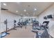 Home gym with weight lifting equipment, treadmill, stationary bike, and mirrored wall at 16713 W Archer Ave, Golden, CO 80401