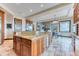 Gourmet kitchen island featuring wood cabinets, granite countertop and stainless dishwasher at 16713 W Archer Ave, Golden, CO 80401
