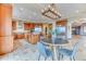 Beautiful kitchen featuring wood cabinets, stainless steel appliances, and a modern light fixture at 16713 W Archer Ave, Golden, CO 80401