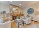 Cozy living room features a fireplace, wood cabinets, comfortable sofas, and stylish decor at 16713 W Archer Ave, Golden, CO 80401