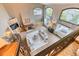 Open-concept living room with fireplace, large windows, and stylish furnishings at 16713 W Archer Ave, Golden, CO 80401