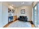 Relaxing living space with a bar, comfortable seating, and access to outdoor balcony at 16713 W Archer Ave, Golden, CO 80401