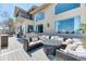 Outdoor seating area with plush cushions, dining table, and grill at 16713 W Archer Ave, Golden, CO 80401
