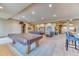 Spacious recreation room with pool table, bar access, and plenty of seating for entertaining at 16713 W Archer Ave, Golden, CO 80401