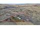 A stunning aerial view of the property showcasing its vast land, including an outdoor building at 428 N Perry Park Rd, Sedalia, CO 80135
