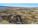 Panoramic aerial view of the rural home surrounded by farmland and distant mountains at 428 N Perry Park Rd, Sedalia, CO 80135