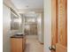 Bathroom with single sink vanity, tiled shower over tub and window for natural light at 428 N Perry Park Rd, Sedalia, CO 80135