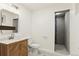 Modern bathroom featuring a decorative wood cabinet sink and glass-enclosed shower at 428 N Perry Park Rd, Sedalia, CO 80135