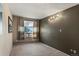 Bedroom featuring a dark accent wall, carpeted floors and large window at 428 N Perry Park Rd, Sedalia, CO 80135