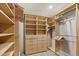 Custom designed closet featuring wood built-ins with shelving and drawers at 428 N Perry Park Rd, Sedalia, CO 80135