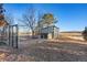 Outdoor dog kennel featuring sturdy fencing and a sheltered dog house, providing a secure space at 428 N Perry Park Rd, Sedalia, CO 80135