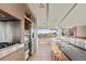 Modern kitchen featuring stainless steel appliances and a large window with scenic views at 428 N Perry Park Rd, Sedalia, CO 80135