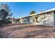 Back exterior featuring a sleek, modern design, large windows, and access to the natural landscape at 428 N Perry Park Rd, Sedalia, CO 80135