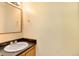 Small bathroom with single sink, mirror and toilet at 17102 E Baltic Dr # F, Aurora, CO 80013