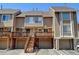 Townhouse exterior with a deck and attached garage at 17102 E Baltic Dr # F, Aurora, CO 80013