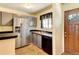 Kitchen with stainless steel appliances and breakfast bar at 17102 E Baltic Dr # F, Aurora, CO 80013