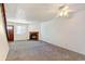 Bright living room with fireplace and carpet at 17102 E Baltic Dr # F, Aurora, CO 80013