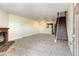 Living room with fireplace and view of kitchen at 17102 E Baltic Dr # F, Aurora, CO 80013