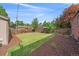 Spacious backyard with lush lawn, mature trees, and well-maintained landscaping, offering a serene outdoor space at 2065 Leyden St, Denver, CO 80207