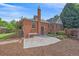 Charming brick home featuring a quaint backyard patio perfect for outdoor relaxation and entertaining at 2065 Leyden St, Denver, CO 80207