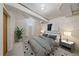 Cozy basement bedroom with a modern design, featuring a large bed and stylish decor at 2065 Leyden St, Denver, CO 80207