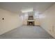Large finished basement area featuring a fireplace with brick surround, ready for customization at 2065 Leyden St, Denver, CO 80207