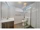 Basement bathroom featuring subway tile surround, modern fixtures, and a glass-enclosed shower at 2065 Leyden St, Denver, CO 80207