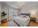 Comfortable bedroom with hardwood floors, natural light, and a queen-size bed at 2065 Leyden St, Denver, CO 80207